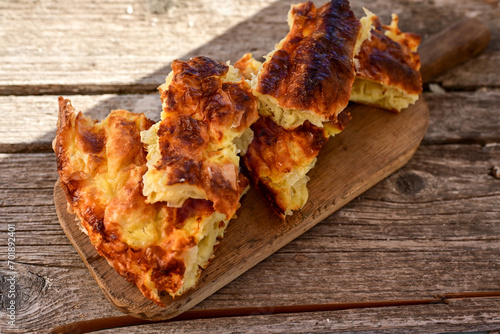 Bakery .Home made  cheese pie  with phyllo pastry and organic eggs. Bulgarian banitsa photo