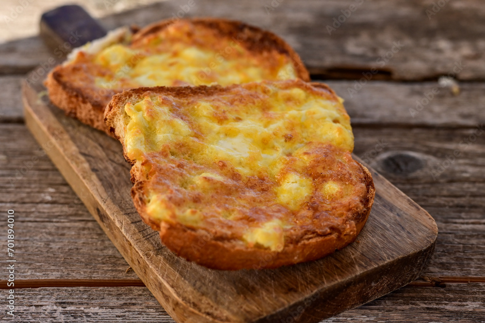 French toast and white cheese. Rustic breakfast made from deep fried bread with organic free range eggs French toast and white cheese. Rustic breakfast made from deep fried bread with organic free range eggs
