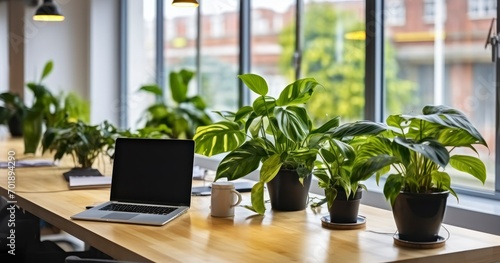 A Laptop and Fresh Greenery Adorning a Table in a Co-Working Office Environment. Generative AI