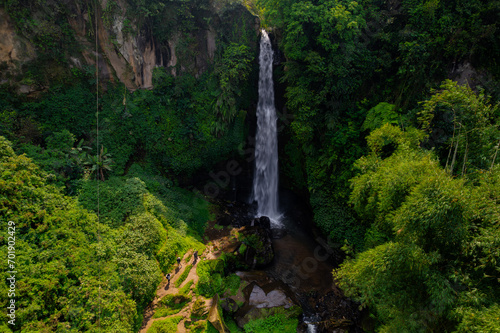 Aerial view of Coban Talun waterfall during an afternoon in East Java, Indonesia photo