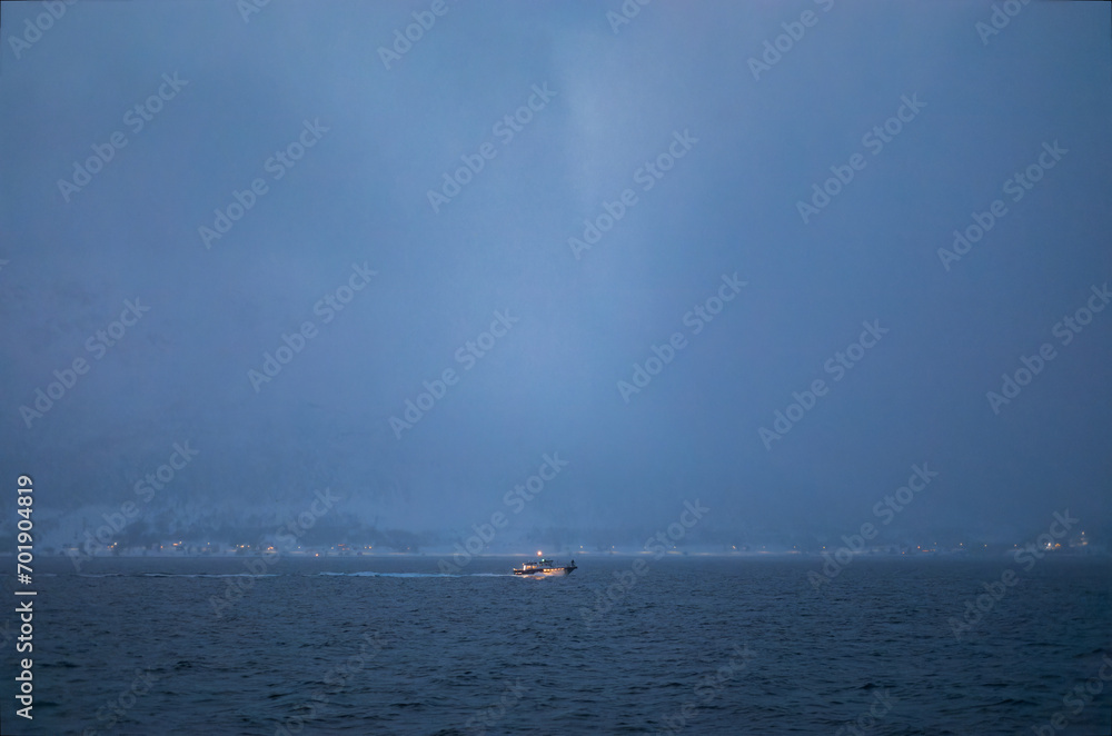 Solitary Boat Journeying Through a Misty Arctic Fjord at dusk
