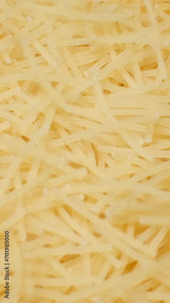 Close up of raw Italian pasta. Cooking pasta. Vertical video Close up of raw Italian pasta. Cooking pasta. Vertical video