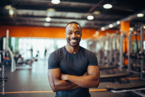Fitness, gym and happy african american man personal trainer ready for workout coaching photo