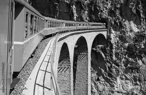 Unesco train trip over the Landwater-Bridge near Tiefencastle in the Swiss Alps photo
