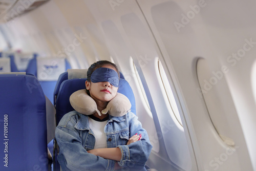  Female passenger sleep on plane flight photo