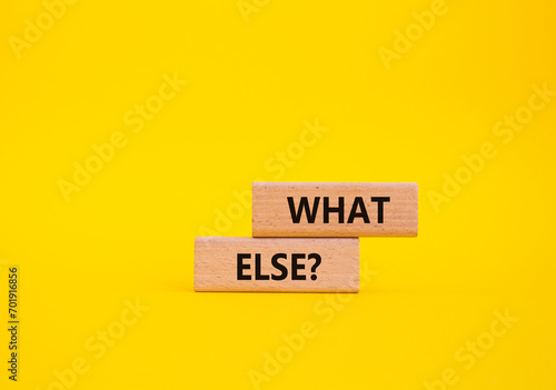 What else symbol. Concept word What else on wooden blocks. Beautiful yellow background. Business and What else concept. Copy space photo