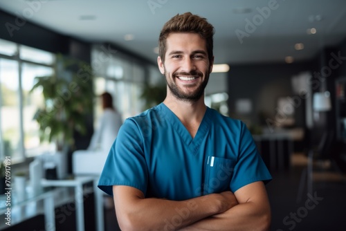 Happy man medical assistant in clinic. Nurse in uniform doctor at hospital
