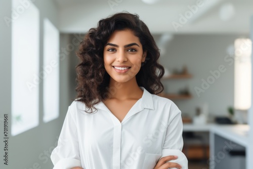 Happy indian woman medical assistant in clinic. Nurse in uniform doctor at hospital