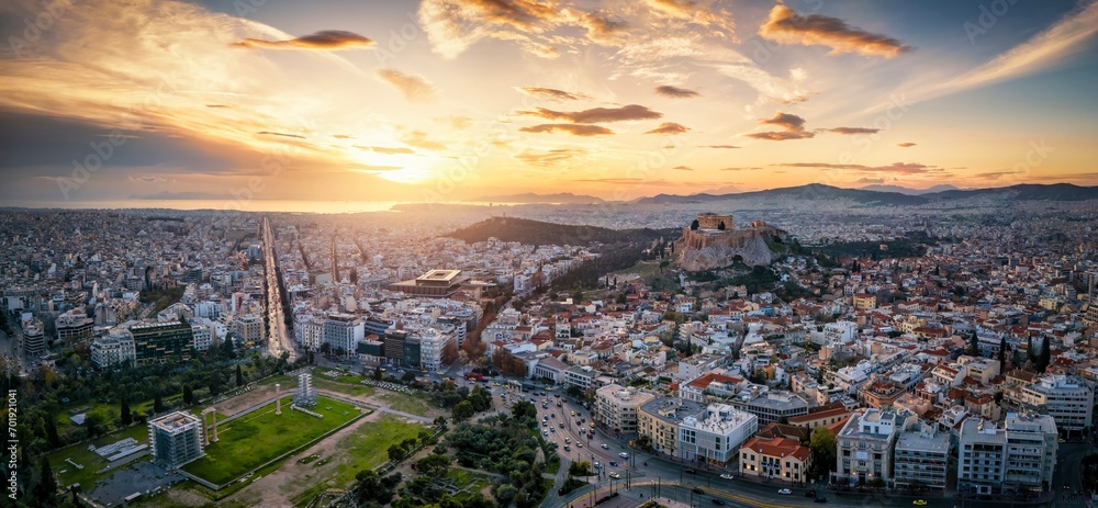 Panoramic aerial view of the urban skyline of Athens, Greece, with Acropolis and Temple of Olympian during sunset time