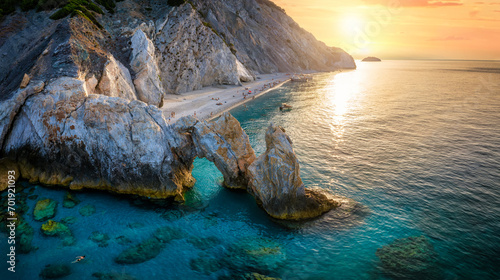 Aerial view of the beautiful Lalaria beach at Skiathos Island, Sporades, Greece, during golden summer sunset time photo