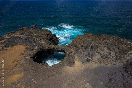Aerial HDR view of 'Pont Naturel' which is a natural bridge formed by lava many years ago on the south coast of Mauritius island.