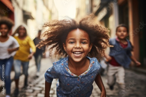 happy african american child girl running on the background of a crowd of people © vasyan_23