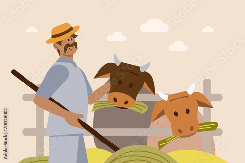 Male farmer feeding cows on farm