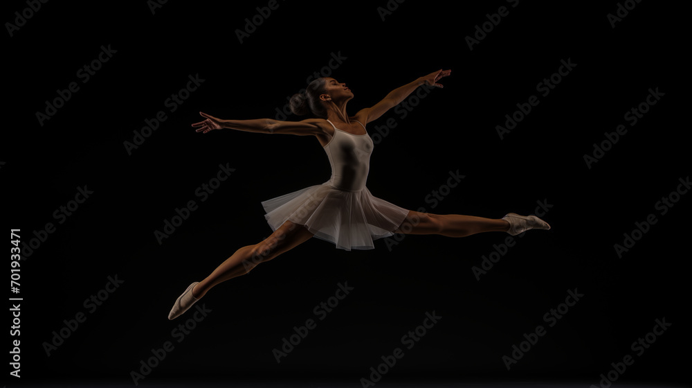 A ballet dancer leaping in the air during a performance to raise awareness for a cause.