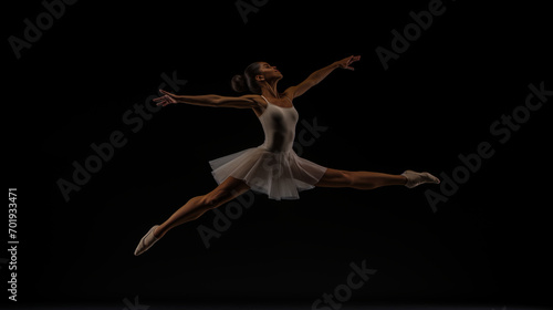 A ballet dancer leaping in the air during a performance to raise awareness for a cause.