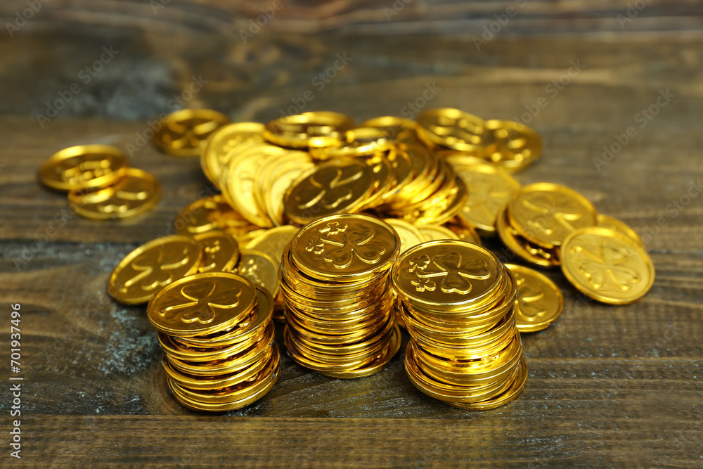 Golden coins on brown wooden table. St. Patrick's Day celebration Golden coins on brown wooden table. St. Patrick's Day celebration