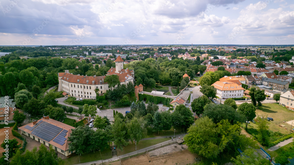 Captivating views of Pułtusk city, castle, and old town from above showcase the enchanting beauty and charm of this historic location. The aerial perspective captures the intricate architecture, wind