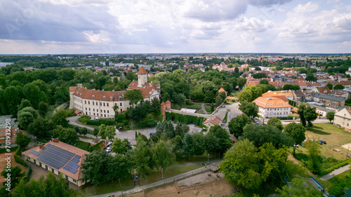 Captivating views of Pułtusk city, castle, and old town from above showcase the enchanting beauty and charm of this historic location. The aerial perspective captures the intricate architecture, wind photo
