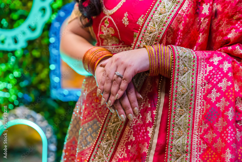 Indian bride's hands bangles and mehndi close up