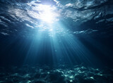 beautiful abstract blue ocean background with underwater scene with rays of light, sun rays and bottom 