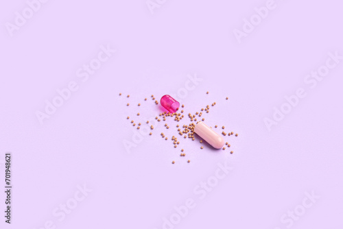 Opened capsule on purple background