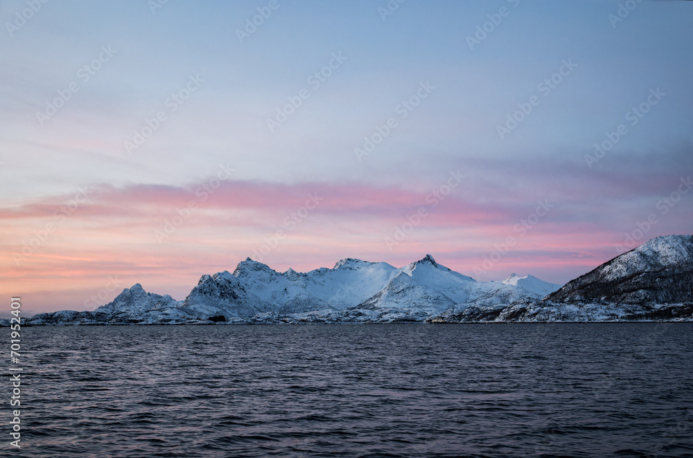 Arctic Dawn: Pastel Skies Over the Snowy Peaks of Lofoten