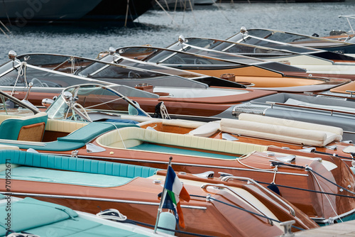Few luxury retro motor boats in row at the famous motorboat exhibition in the principality of Monaco, Monte Carlo, the most expensive boats for the richest people, boats for rich clients photo