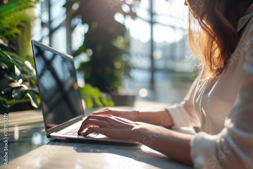 Businesswoman typing on laptop keyboard sitting in office Free Download Businesswoman typing on laptop keyboard sitting in office - GFXLoad