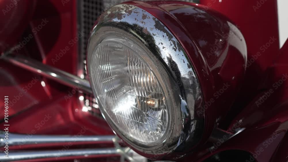 Old american car headlight with rust elements. Close up shiny light and front side of vintage