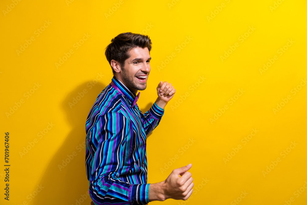 Portrait of cheerful guy dressed stylish shirt bow tie look at discount empty space dancing isolated on bright yellow color background Portrait of cheerful guy dressed stylish shirt bow tie look at discount empty space dancing isolated on bright yellow color background
