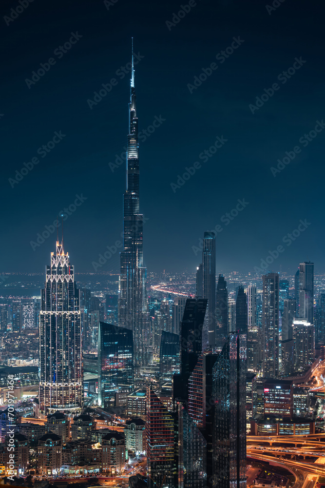 Obraz premium Futuristic Dubai skyline at night, United Arab Emirates (UAE).