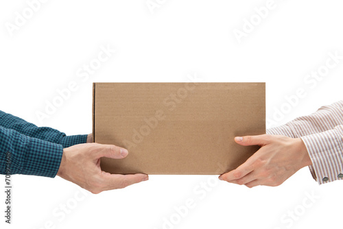 Male hands giving a package, female hands receiving a package. Purchase delivery concept © ilyaska