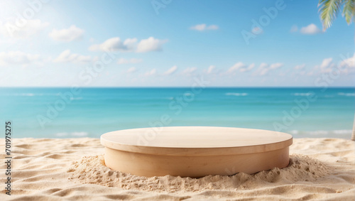 wooden podium for product presentation on beach sand with blurred beach background