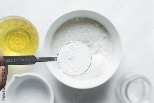 A spoon of baking soda or baking powder photo