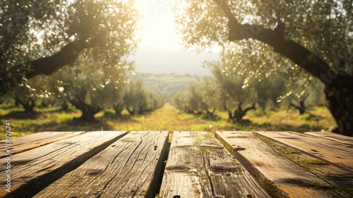 Empty wood table with ample free space against a backdrop of lush olives field. Copy space for text. Organic Agriculture olive oil concept. AI Generative 