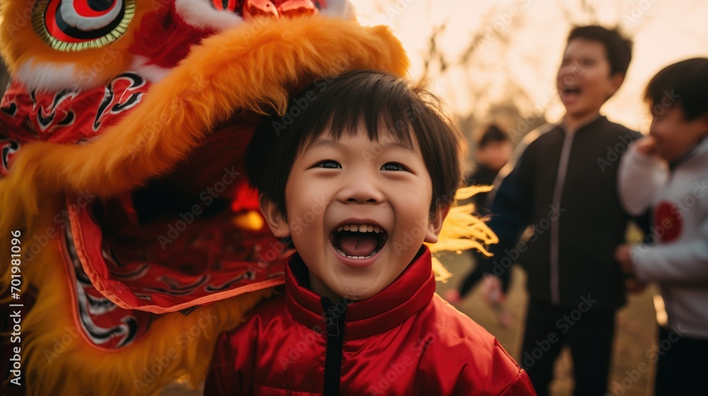 A child in a red jacket laughs in delight next to a lion dance costume during a Lunar New Year celebration - obrazy, fototapety, plakaty 