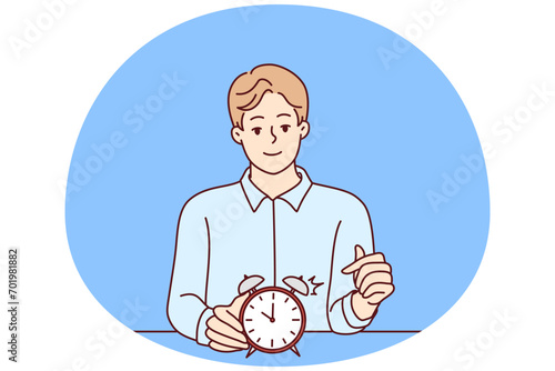 Smiling man points finger at alarm clock to remind of beginning or end of lunch break. Concept time management and control over optimal use of working period. Flat vector illustration