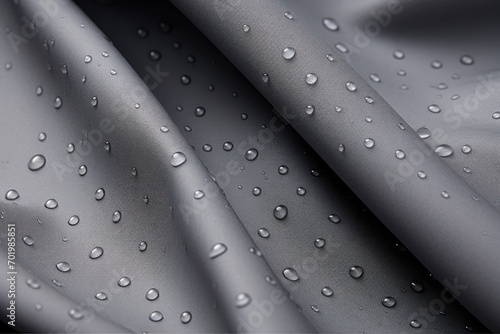 Technological fabric in grey color waterproof and breathable resembling raindrops photo