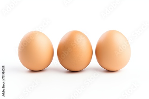 Three eggs on a white surface