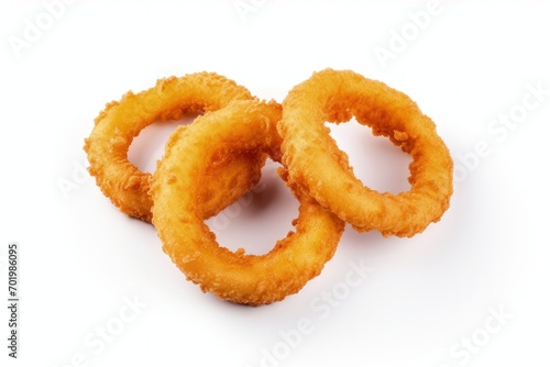 Three onion rings with a golden breaded and crispy batter isolated on a white background seen from above