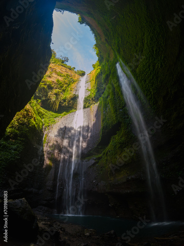 View of Madakaripura waterfall from a cave in East Java, Indonesia
