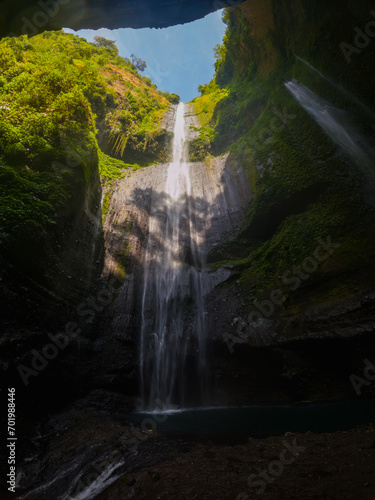 View of Madakaripura waterfall from a cave in East Java  Indonesia