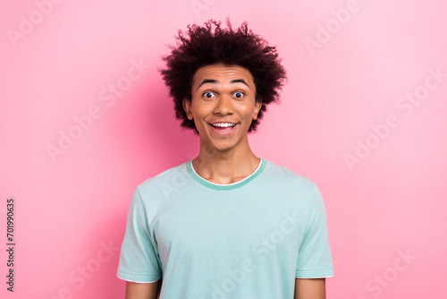 Photo of adorable impressed man dressed blue t-shirt smiling open mouth isolated pink color background