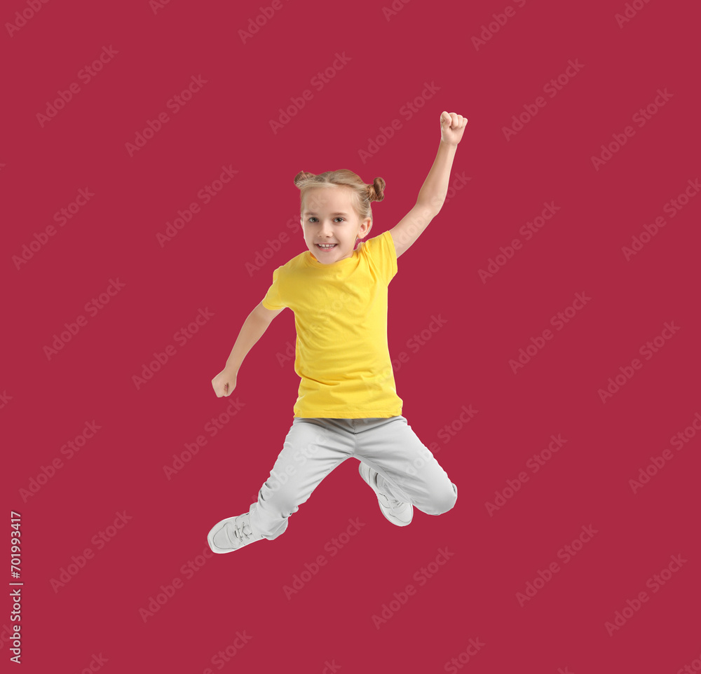 Happy cute girl jumping on red background Happy cute girl jumping on red background