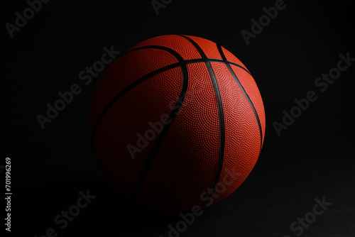 One new basketball ball on black background