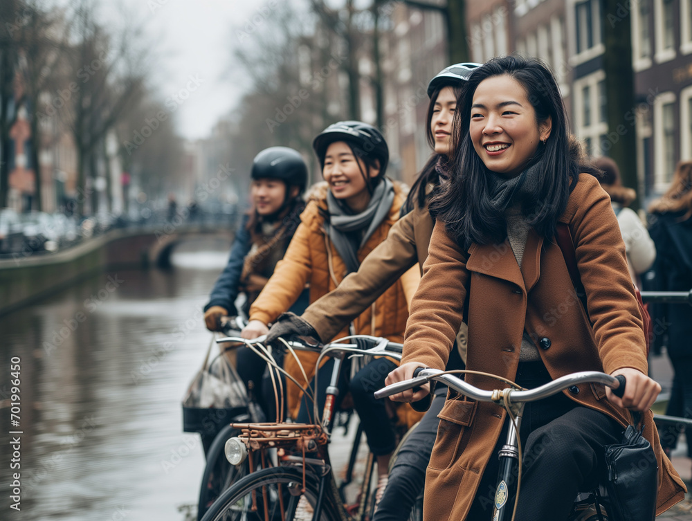 A Photo Of A Group Of Asian Friends Enjoying A Bike Tour In Amsterdam Netherlands