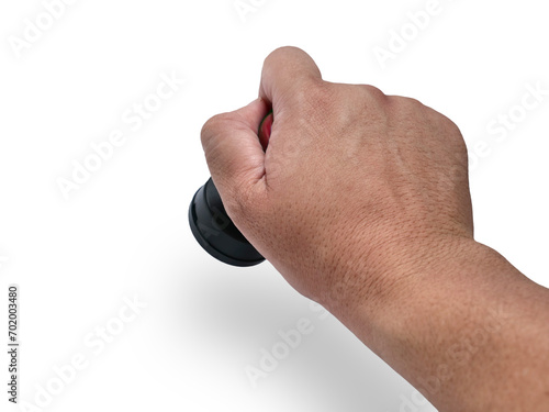 Hand holding red handled round rubber stamp, top view isolated on white