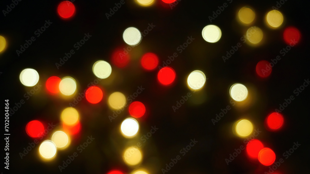 Defocused blurry multicolored blinker lights bokeh of Christmas and New year decoration lights, abstract, dark background, overlay for party, shallow DOF, festive mood Defocused blurry multicolored blinker lights bokeh of Christmas and New year decoration lights, abstract, dark background, overlay for party, shallow DOF, festive mood