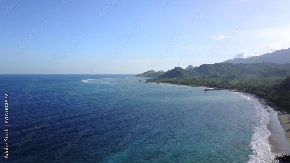 Morning aerial view of Pentai Paga in the village of Paga, East Nusa Tenggara, Indonesia Morning aerial view of Pentai Paga in the village of Paga, East Nusa Tenggara, Indonesia
