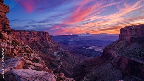 Canyon landscape with sharp angles and smooth curves, showcasing the dynamic twilight sky